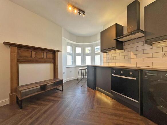 Modern kitchen with chic dark cabinetry....