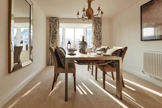 Double doors lead from the dining area to the garden, perfect for al fresco dining