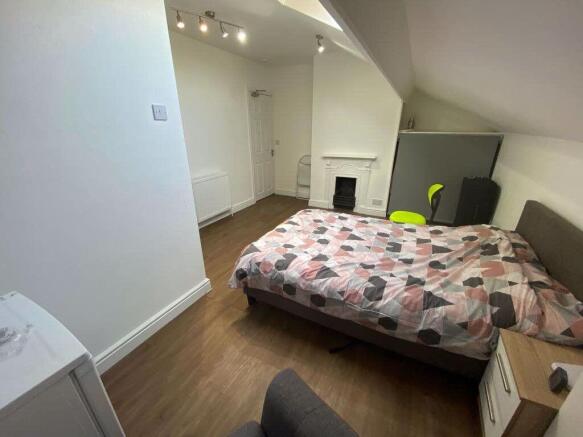 A bright and tidy living room featuring a conte...