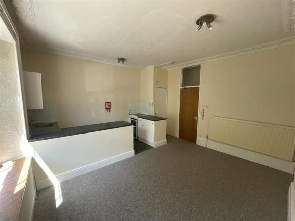 Bright open-plan kitchen with breakfast bar...