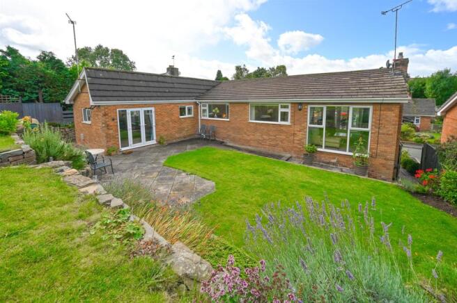Landscaped gardens and patio areas to rear