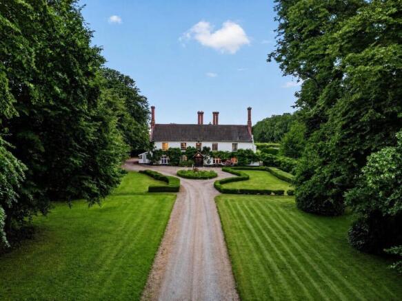 Aerial view of Bury's Hall with formal gardens and