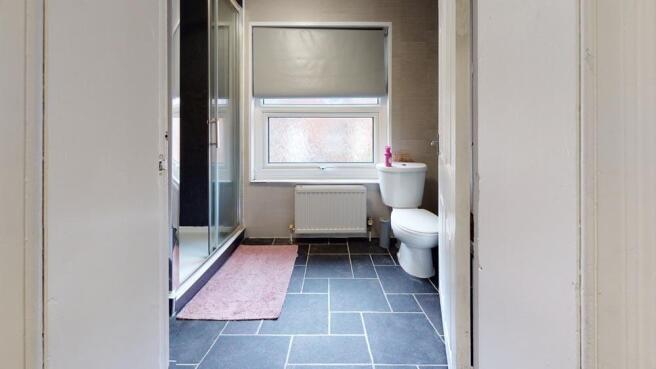 A clean and well-maintained bathroom with a lar...