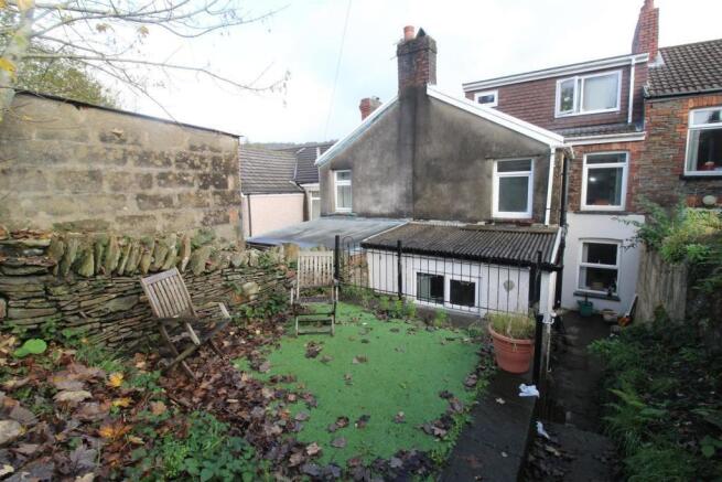 Private outdoor garden space with seating area...