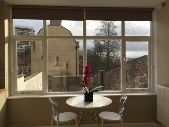 Bright dining spot with large scenic windows...