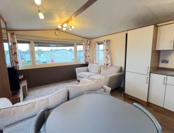 Bright Open Plan Lounge And Dining Area With Comfo