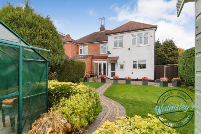 Rear gardens with greenhouse shed and gated side a