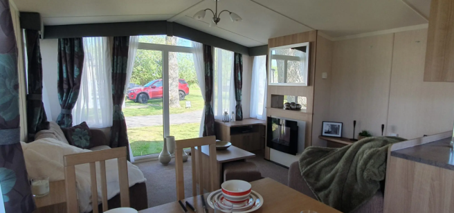 Bright Lounge With Full Length Windows And Feature
