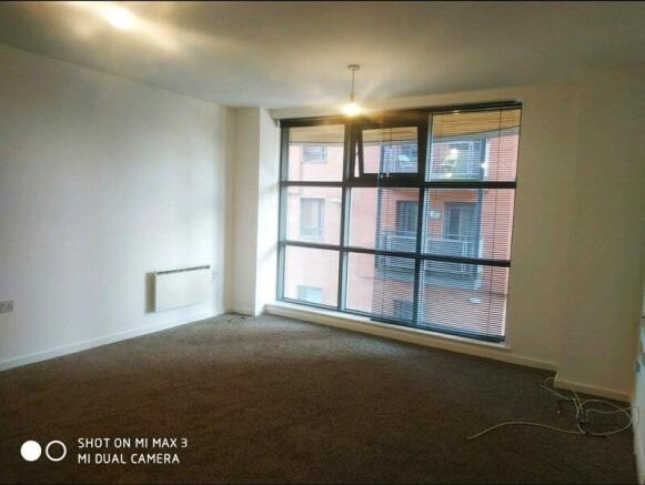 Bright and airy bedroom with large windows...
