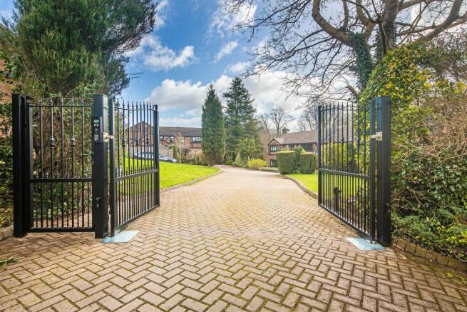 Gated entrance to road