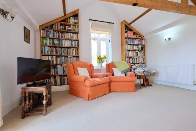 TV area with fitted bookshelves