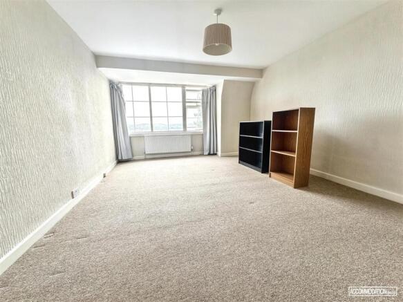 Bright and spacious room with ample storage spa...