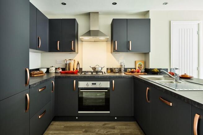 Kitchen is modern with ample storage