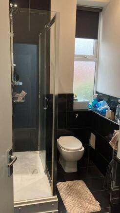 Modern bathroom with a glass shower enclosure, ...