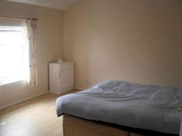 Bright and airy bedroom with ample floor space...
