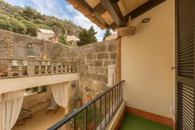 Upper balcony with traditional shutters