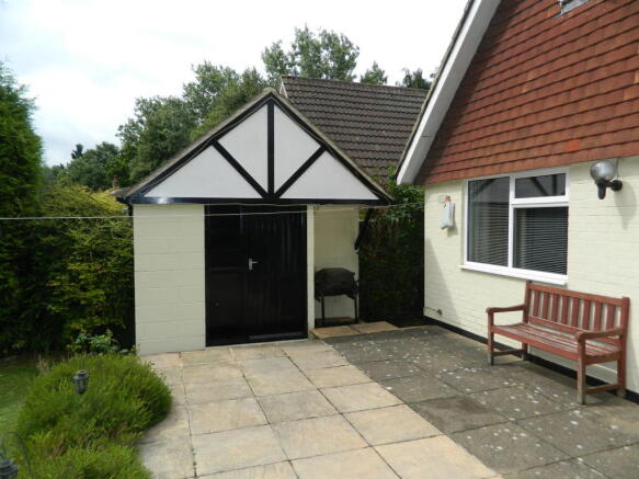 brick built shed with power & light, ideal for BBQ area