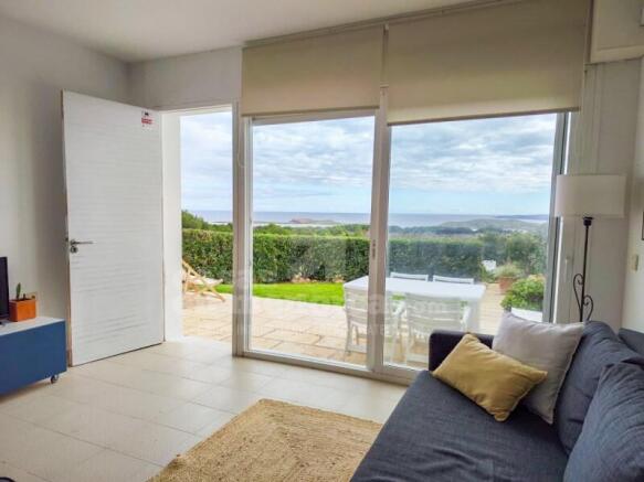 Apartment with sea views and private garden in Coves Noves