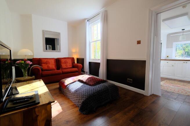 Sun filled sitting room and kitchen