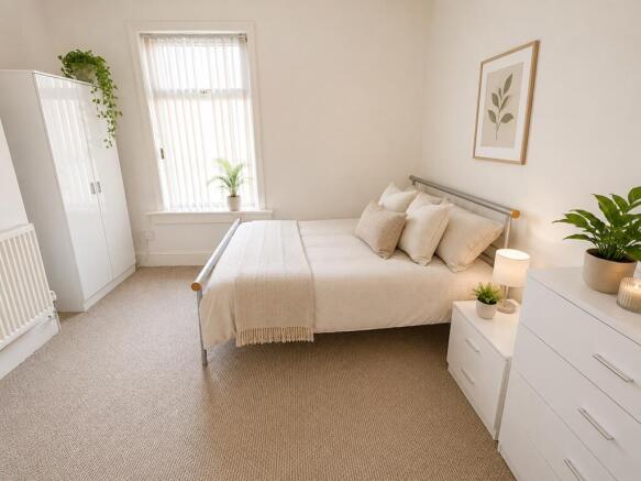 Bright and airy bedroom with stylish decor and ...