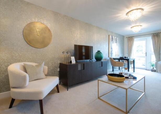 a living room with a white couch and a round table