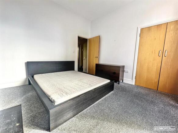 Spacious double bedroom with built-in storage...