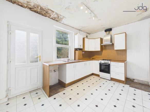 Kitchen with ceiling being replastered and new flooring going down