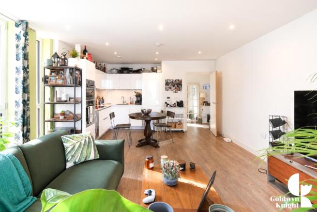 Bright Modern Green-Accented Open-Plan Interior