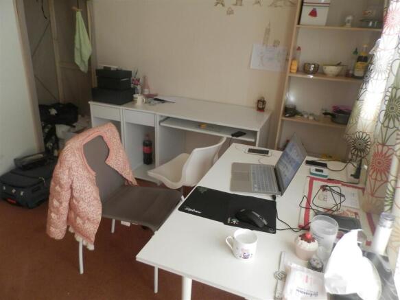 Bright shared workspace with long desks, ergono...