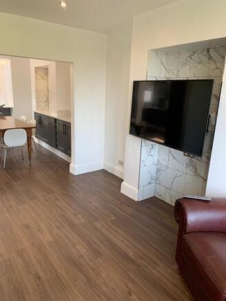 Modern and well-maintained living room featurin...