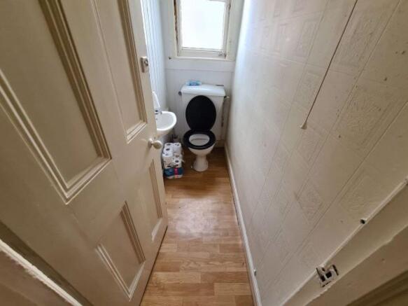 Compact and functional toilet room featuring wo...