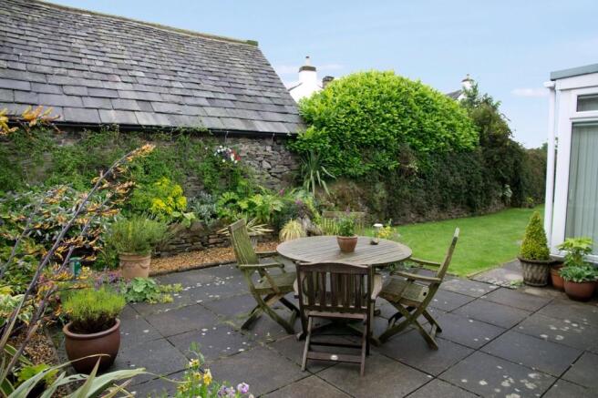 Rear patio and ga...