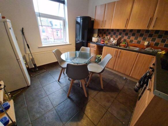 Bright kitchen featuring a modern tiled floor, ...