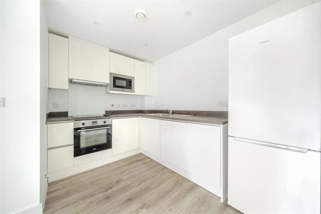 Bright modern kitchen with high-gloss cabinets...