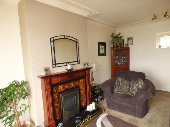 Attractive Lounge With Feature Fireplace And Super