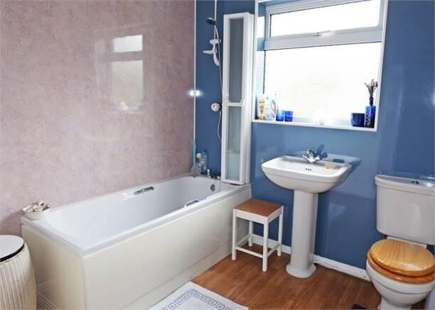 Bathroom with separate shower over the bath