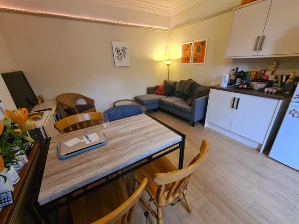 Bright, well-kept living space with a dining ta...