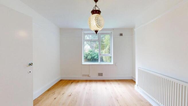 Bright and airy master bedroom featuring a larg...