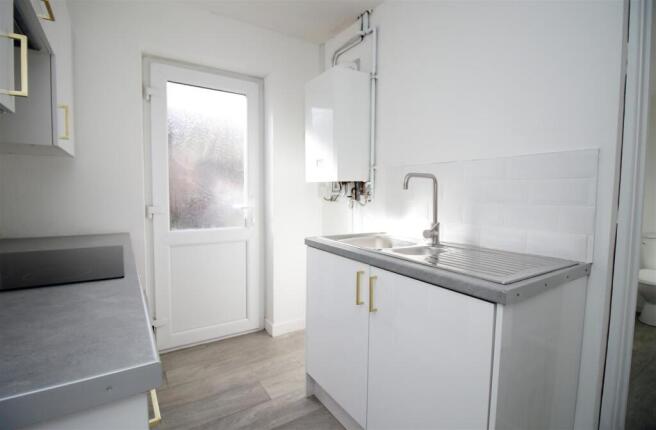 Bright modern utility space with garden access...