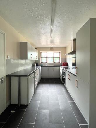 Kitchen with double oven and microwave