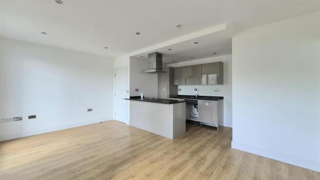 OPEN PLAN LIVING AND KITCHEN AREA