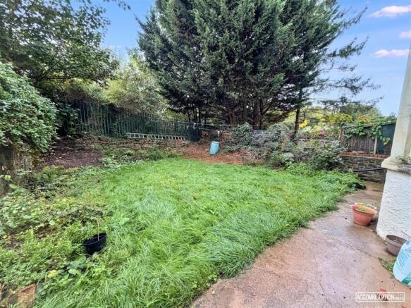 Spacious private garden with lawn and patio are...