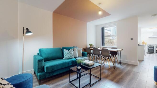 A spacious and modern living room with ample na...