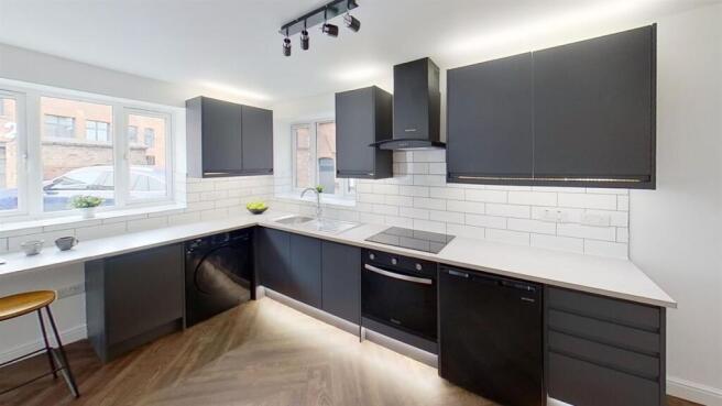 Sleek, modern kitchen with ample counter space....