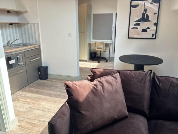 Bright modern living area with dedicated desk...