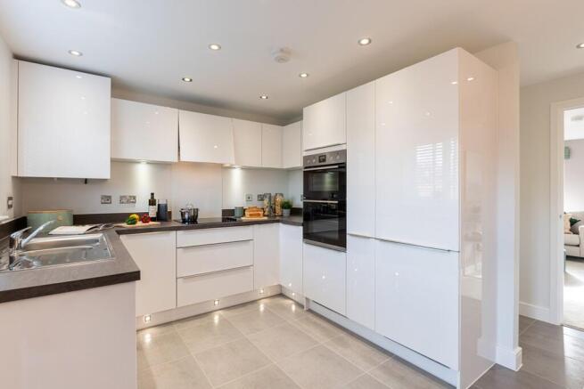 Modern 3-sided kitchen has ample worktop and storage space