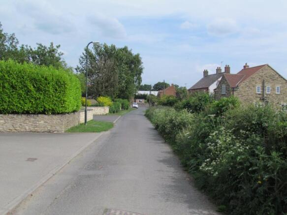 STREET SCENE FROM THE EAST AND WEST