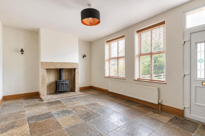 Empty Cottage Living Room with Stone Fireplace (1)