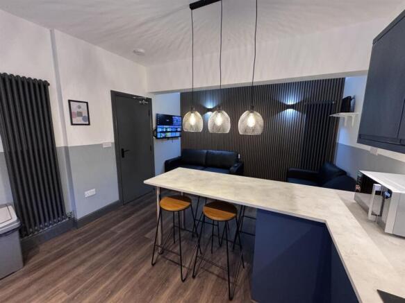 Stylish open-plan kitchen with a breakfast bar...