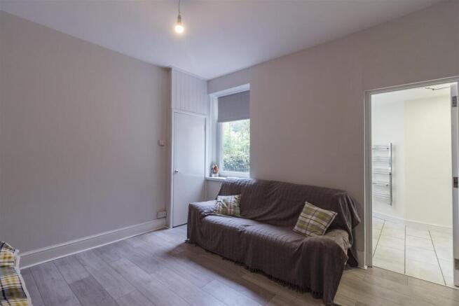 Bright lounge area with modern wood flooring...